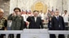 지난 7월 평양에서 열린 한국전 정전 70주년 열병식에서 김정은 북한 국무위원장이 세르게이 쇼이구 러시아 국방장관, 리훙중 중국 전인대 상임 부위원장과 함께 나란히 주석단에 앉았다.