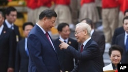 2023年12月12日，中國國家主席習近平和越共總書記阮富仲在河內總統府出席歡迎儀式。（美聯社照片）