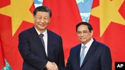 中國國家主席習近平與越南總理阮晉勇在河內舉行會晤。 （美聯社2023年12月13日）