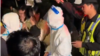 资料照：2023年10月31日上海万圣节街头聚会扮演大白的人被警察带走。（照片来自推特视频截图）
