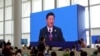 记者在博鳌论坛新闻中心观看中国国家主席习近平讲话（2018年4月10日）