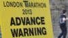 A road closure sign is seen placed along The Mall, the location for the London Marathon finish line, in central London April 16, 2013. 