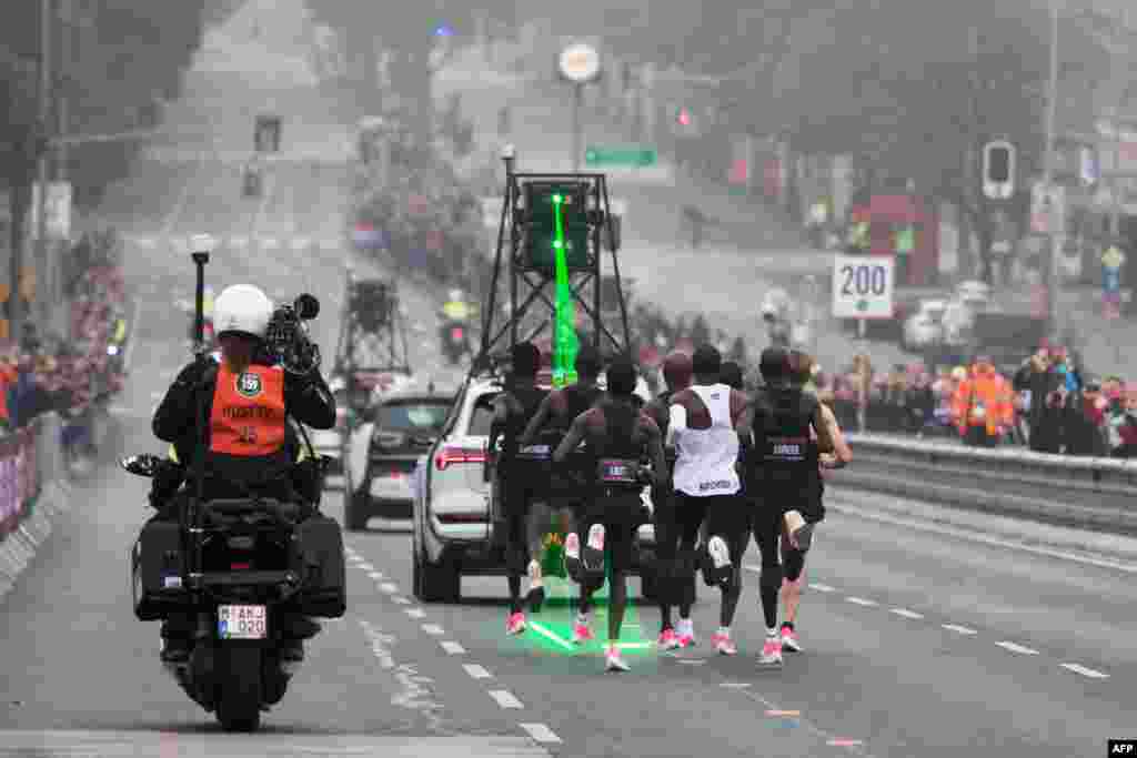 Kenya's Eliud Kipchoge (white jersey) takes the start of his attempt to bust the mythical two-hour barrier for the marathon in Vienna, Austria. Kipchoge held the men's world record for the distance with a time of 2hr 01min 39sec.
