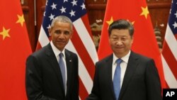 美國前總統奧巴馬(左)與中國國家主席習近平(右)2016年9月在杭州G-20峰會上資料照。