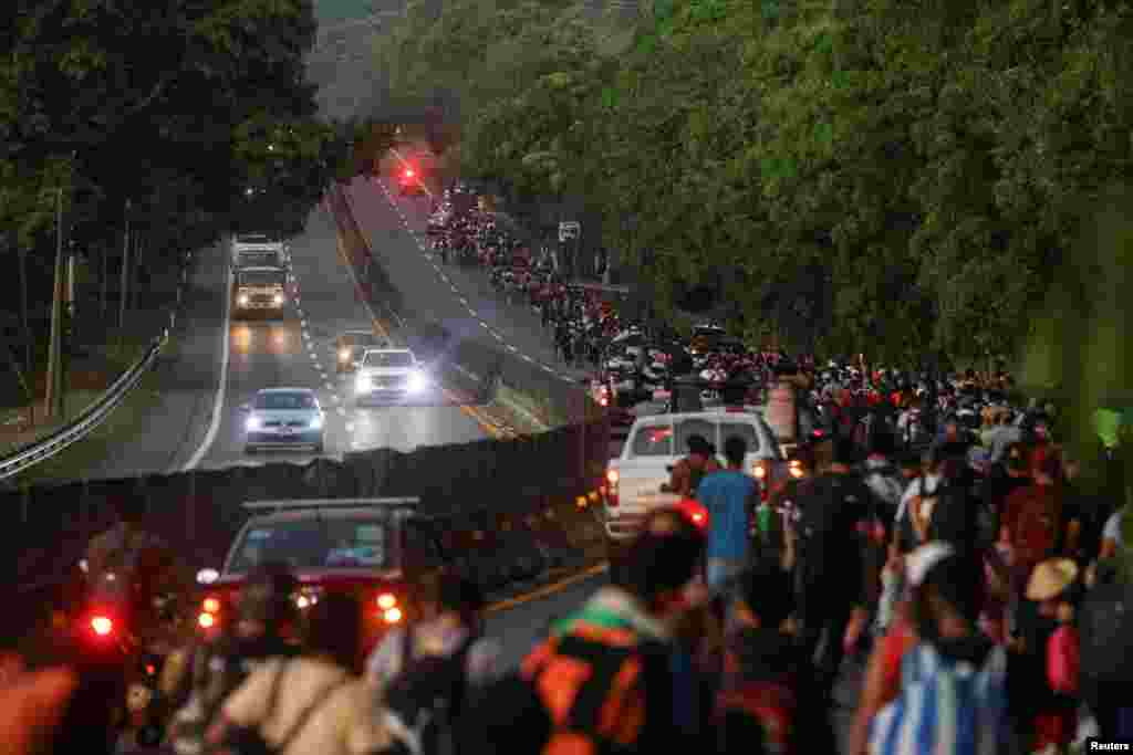 Migrants walk in a caravan bound for the northern border with the U.S., in Huehuetan, Mexico on January 26, 2025.