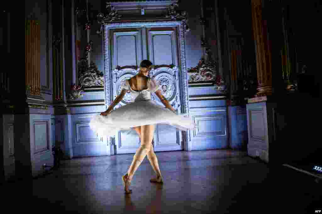 A dancer of the Paris Opera Ballet performs during the dancing show "Degas Danse" on the sidelines of the exhibition "Degas at the Opera" at the Orsay museum in Paris, France, Oct. 9, 2019.