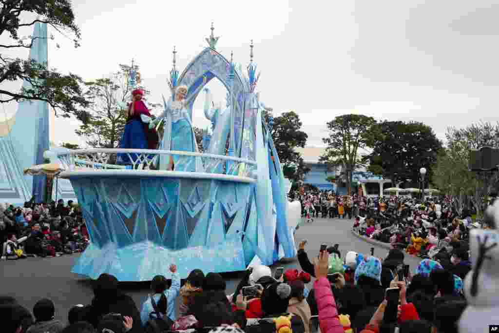 Performers dressed in Disney's animation movie "Frozen" characters take part during the Disney Christmas Stories parade held at Tokyo Disneyland in Urayasu, near Tokyo, Japan.