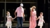 Pedestrians wear masks as they cross Brand Boulevard, Thursday, July 23, 2020, in Glendale, Calif. 