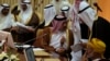 Qatar's Foreign Minister Khalid bin Mohamed Al-Attiyah (L) attends Gulf Cooperation Council (GCC) meeting in Riyadh June 2, 2014. 