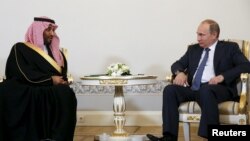 Russian President Vladimir Putin (R) attends a meeting with Saudi Defence Minister Prince Mohammad Bin Salman at the Konstantin (Konstantinovsky) Palace in St. Petersburg, Russia, June 18, 2015. REUTERS/Grigory Dukor