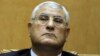 Egypt's chief justice Adly Mansour listens to a speech during his swearing in as interim president Thursday, July 4, 2013. 