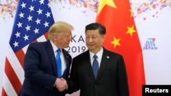 時任美國總統特朗普與中國國家主席習近平在日本大阪舉行的G20領導人峰會中握手。 (2019年6月29日)