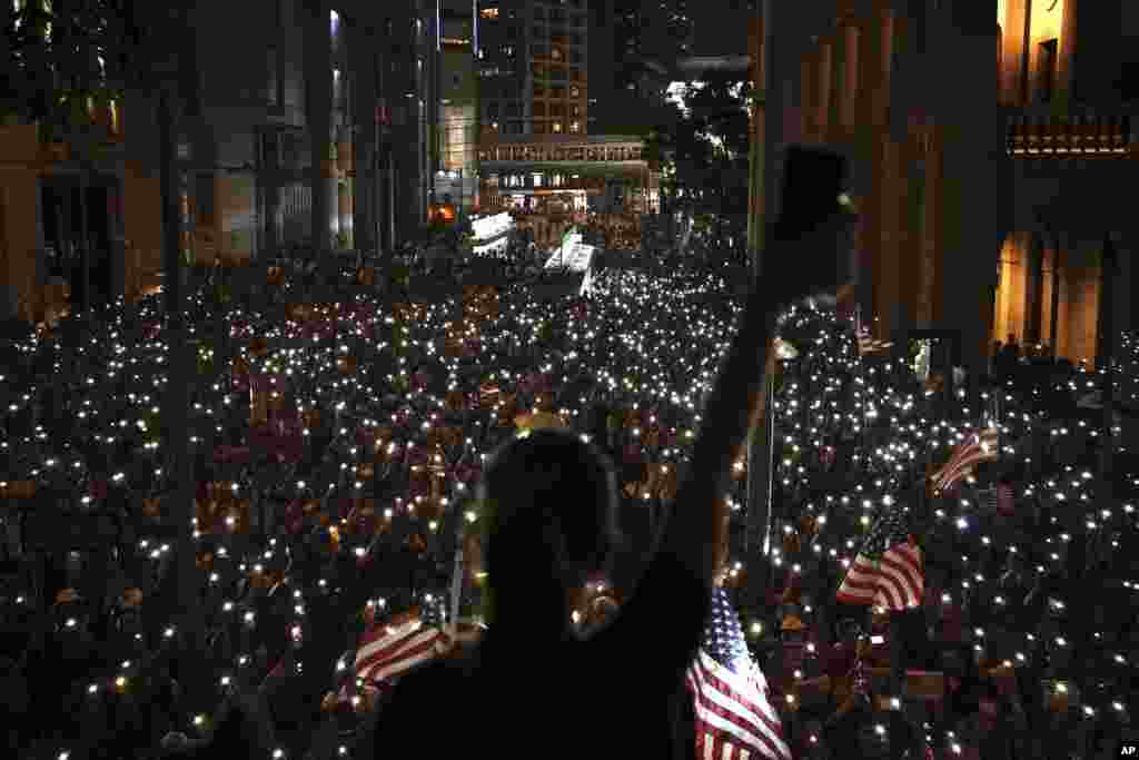 Protesters light torches during a peaceful rally in central Hong Kong's business district.