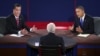 Republican presidential nominee Mitt Romney and President Obama answer a question during the third presidential debate focused mostly on the Middle East, October 22