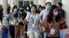 Passengers wearing medical masks are pictured at the international arrival terminal of I Gusti Ngurah Rai airport following an outbreak of the new coronavirus in China, in Bali, Indonesia, Feb. 4, 2020.