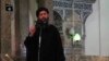 Image taken from recently released video shows man purported to be Abu Bakr al-Baghdadi, ISIL's reclusive leader, making what would be his first public appearance at a mosque in the center of Iraq's second city, Mosul July 5, 2014.