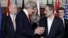 U.S. Secretary of State John Kerry, second from left, talks to Syria opposition coalition president Moaz al-Khatib, second from right, at conference boosting global aid to rebel fighters, Thursday, Feb. 28, 2013. (AP)