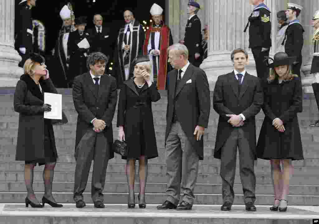 Members of Margaret Thatcher's family from left, daughter Carol Thatcher and partner Marco Grass, Sarah Thatcher, wife of son Mark Thatcher, and grandchildren Michael and Amanda Thatcher after the funeral of former British Prime Minister Margaret Thatcher.
