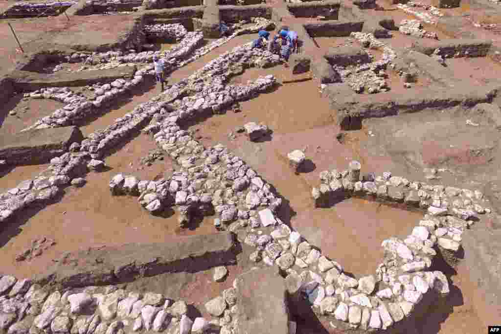 Israeli archaeologists work at the ancient site of En Esur (Ein Asawir) where a 5000-year-old city was uncovered, near the Israeli town of Harish.
