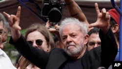 Former Brazilian President Luiz Inacio Lula da Silva acknowledges supporters during a rally at the Metal Workers Union headquarters, in Sao Bernardo do Campo, Brazil, Nov. 9, 2019. 