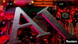 2023年6月23日拍攝的這幅插圖中，AI(人工智能)字母被放置在電腦主板上。(路透社)