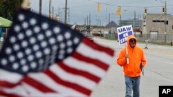 Rocky Perry, a 20-year General Motors employee, pickets outside the GM Fabrication Division, Oct. 16, 2019, in Parma, Ohio. 