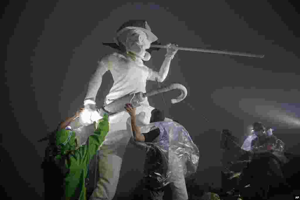 Anti-government protesters set up a four-meter statue "The Lady Liberty of Hong Kong", that symbolizes the city's recent democratic movement, was brought to Lion Rock, one of Hong Kong's iconic peak.