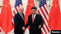 2013年12月4日，中国国家主席习近平与美国副总统拜登在北京人民大会堂会面