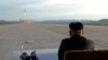 FILE - North Korean leader Kim Jong Un watches the launch of a Hwasong-12 missile in this undated photo released by North Korea's Korean Central News Agency (KCNA).