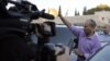 Naftali Bennett, leader of the Bayit Yehudi party, waves after a visit to the Western Wall in Jerusalem's Old City ahead of Israel's parliamentary election, January 21, 2013. 